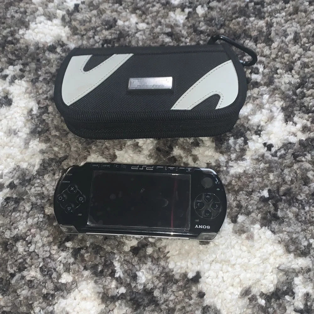 PSP Bundle with 7 games + case and extra disc holder and TV cables